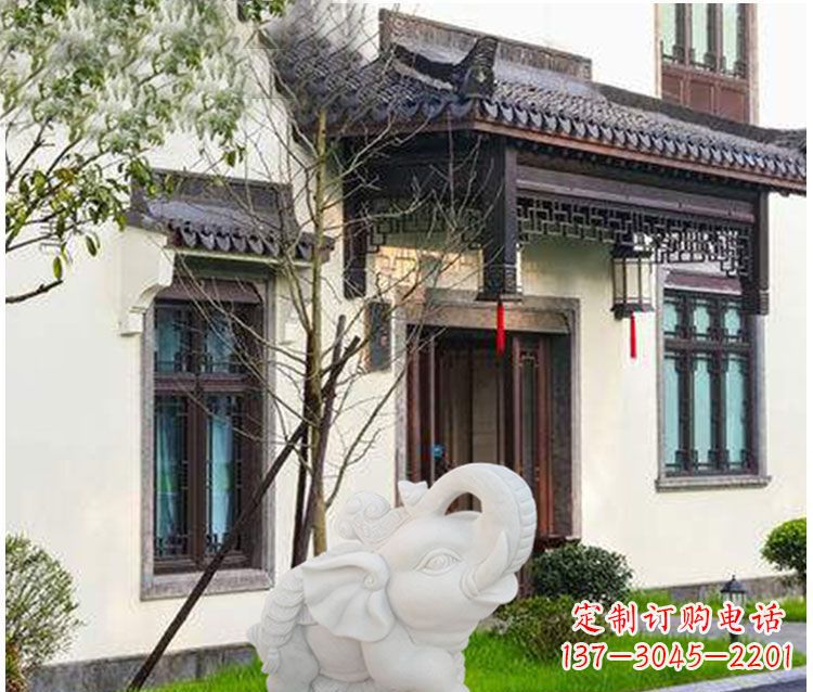 辽阳踩元宝铜钱的小象门口招财石雕