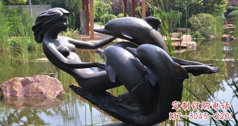辽阳公园海豚和女孩景观铜雕