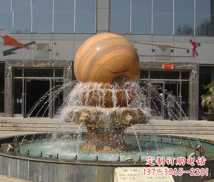 辽阳石来运转球晚霞红风水球石雕