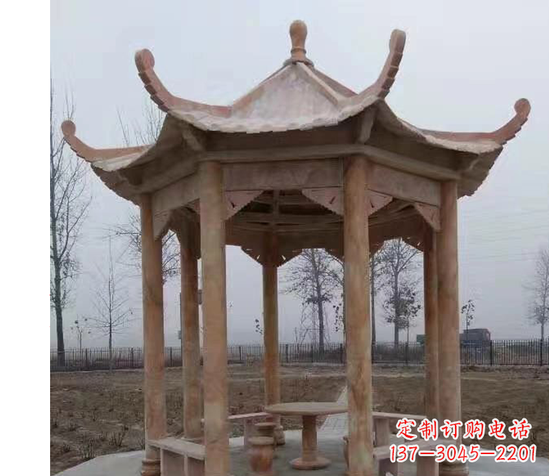 辽阳公园晚霞红八角石雕凉亭
